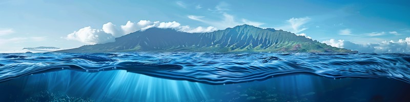 photo of a volcanic island with the ocean in the foreground