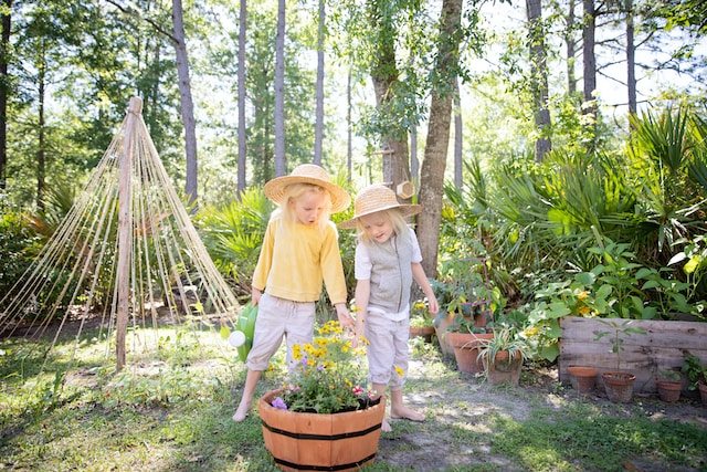 child enjoying the sensory elements of the garden